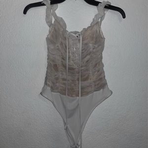 white ruffle bodysuit